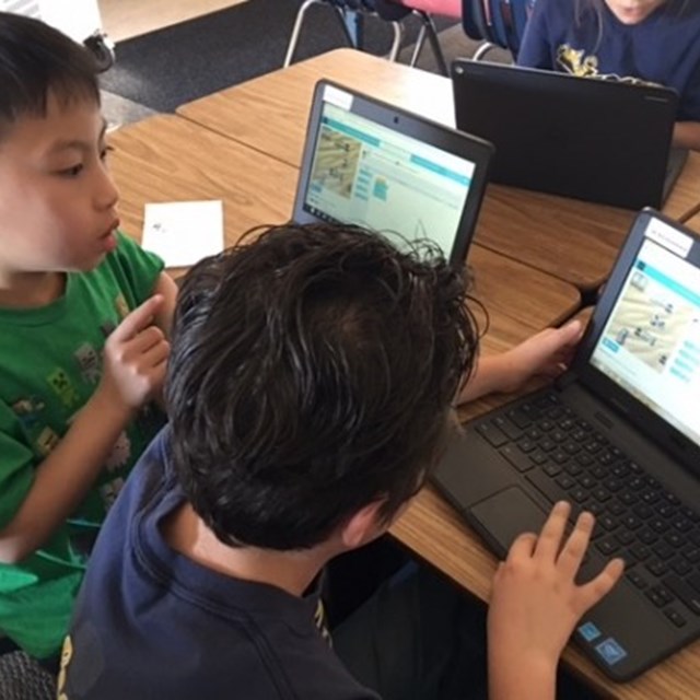 These third graders are proud to put their adept coding skills to good use.