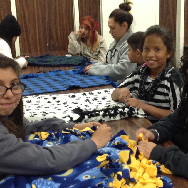 Warren girls make blankets as an extracurricular activity.